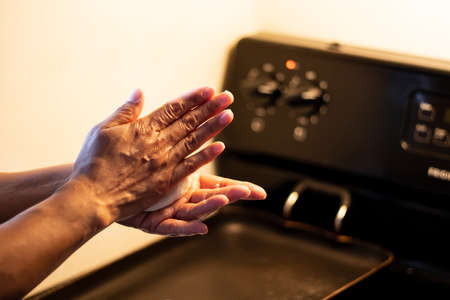 Traditional corn tortilla made by hand on stove from Guatemala and Central Americaの写真素材