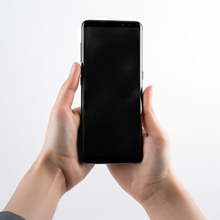 Blank Screen Mobile Phone in Hand on White Background - Realistic Photography for Web and Landing Pages. Generative AIの素材