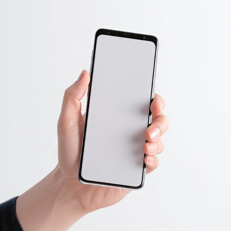 Blank Screen Mobile Phone in Hand on White Background - Realistic Photography for Web and Landing Pages. Generative AIの素材