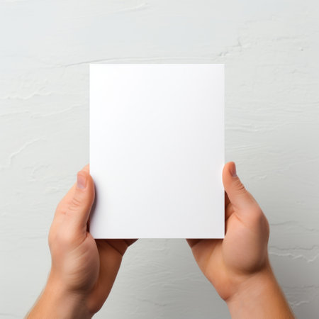 Hands holding blank business card on white background. Mockup for branding identity. Generative AIの素材