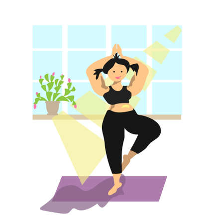 A girl with a positive attitude is engaged in yoga at home. Concert-body positiveの写真素材