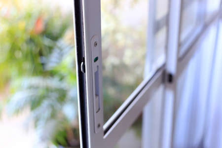 White color aluminum and glass window door.