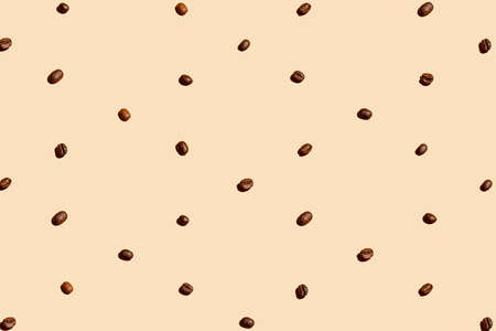 Coffee beans organized and forming a texture over pastel background.の写真素材