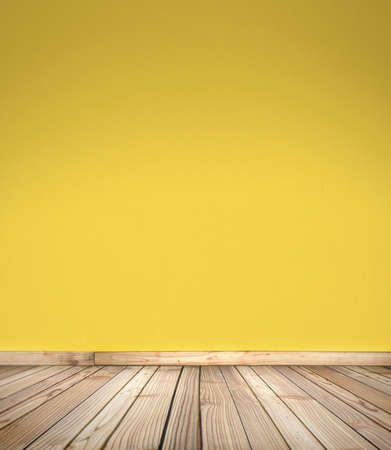 Wooden deck stage for products, things and people. Empty rustic wood floor, platform with blurred yellow wall background. With copy space. Graphic resource for design and mockup.の写真素材