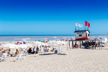 CARILO, BUENOS AIRES, ARGENTINA - JUANARY 09, 2023: Panoramic view of the beach. The people enjoying the beach in a sunny summer day on the Atlantic coast.のeditorial素材