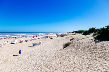 CARILO, BUENOS AIRES, ARGENTINA - JUANARY 09, 2023: Panoramic view of the beach from the top of the dune. Sunny summer day at the atlantic coast.のeditorial素材