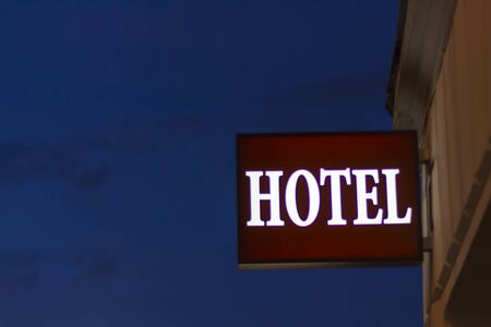 Hotel sign against a blue hour skyの写真素材
