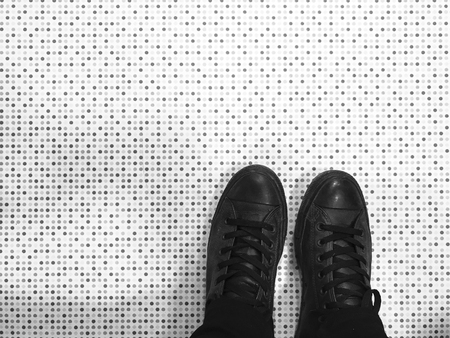 Black shoes and floor in minimalist styleの写真素材