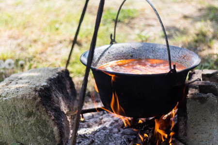 Gulyas stew boiling in a cauldronの写真素材