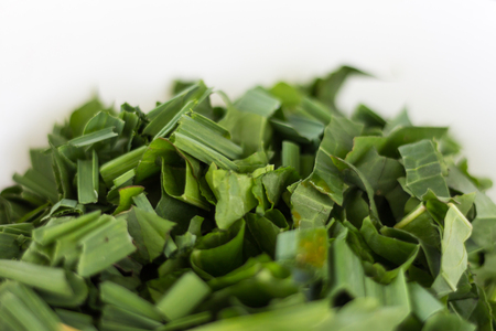 Chopped scallion on a white backgroundの写真素材