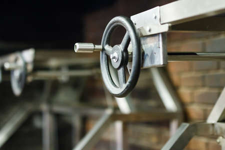 black faucet with handle in the interior of the restaurant and cafeの写真素材