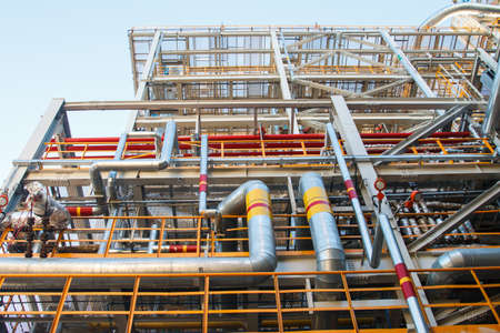 Industrial factory, steel pipelines, tubes at brewery production. Large workshop with tools...