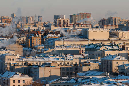 industrial heating station pipes of red and white bricks in the cityの写真素材