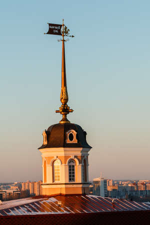 Russia. Tatarstan. Kazan. Consistory tower of the Kazan Kremlin and part of the white-stone walls with adjacent office buildings in winter.の写真素材