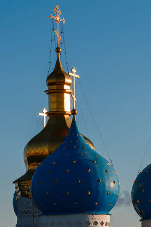 Dome with a golden cross on top of the building of the Orthodox chapel. The dome of the church. The Christian crossの写真素材
