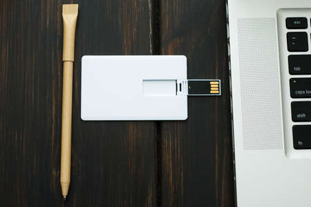 Corporate branding mockup template, isolated on dark wooden background.workspaceの写真素材