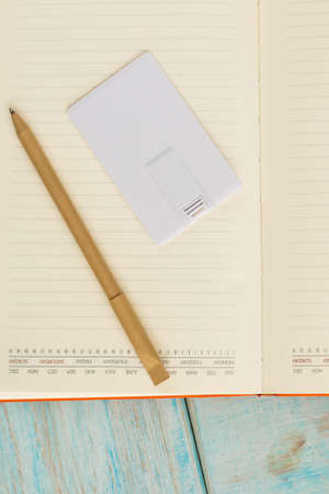 Corporate branding mockup template, isolated on wooden and leather background.の写真素材