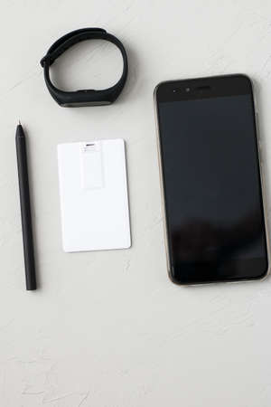 Photo of blank stationery set on wood background. Envelope, business cards, pencil, and A4 paper. Corporate identity template. Responsive design mockup.の写真素材