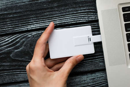 Blank white plastic wafer usb card design mockup holding hand. Visiting flash drive namecard mock...