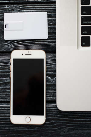 Photo of blank stationery set on wood background. Envelope, business cards, pencil, and A4 paper. Corporate identity template. Responsive design mockup.の写真素材