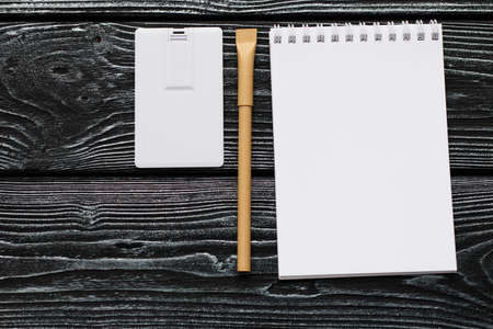 Corporate branding mockup template, isolated on dark wooden background.の写真素材