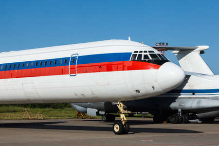 Large wide-body passenger aircraft nose closeup view standing at parking place at airport.Detail  of an airplane parked in the airportの写真素材