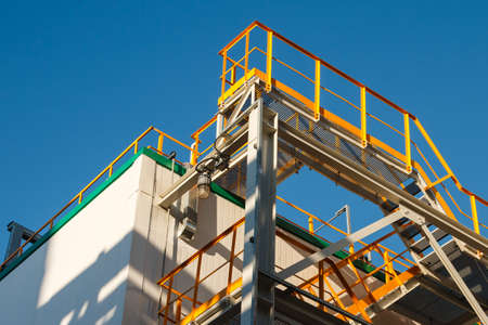 Equipment, cables and piping as found inside of a modern industrial power plant