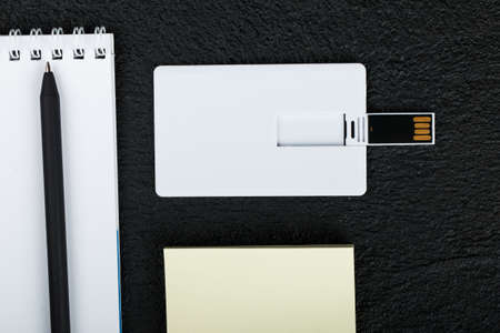 Workspace with envelope, wallet, business card, notebook, pencil, badge. Office desk wooden...