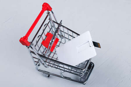 Business card blank, notepad, mobile phone, vallet, smart watch, notebook, mini food basket and pen at office desk table top view. Corporate stationery branding mock-upの写真素材