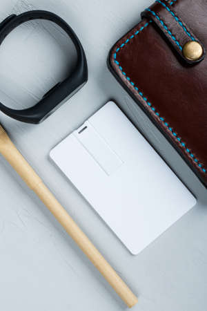 Business card blank, notepad, mobile phone, vallet, smart watch, notebook, mini food basket and pen at office desk table top view. Corporate stationery branding mock-upの写真素材