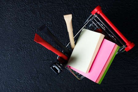 toy mini food cart with stationery (red pen, black pen, stapler)の写真素材