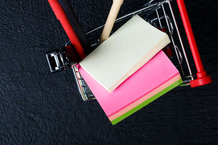 toy mini food cart with stationery (red pen, black pen, stapler)の写真素材