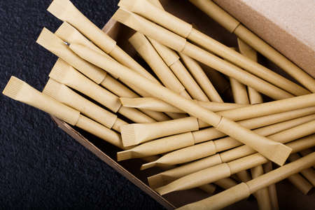 Beige pens mock up isolated on black. top viewの写真素材