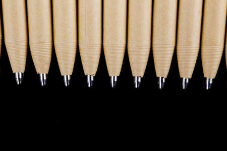 set of beige pens mockup design on black dark wooden backgroundの写真素材