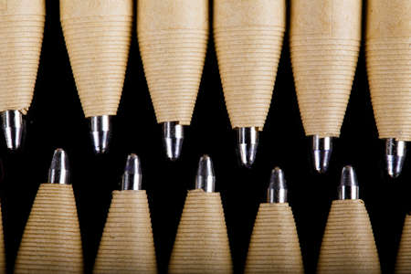 set of beige pens mockup design on black dark wooden background