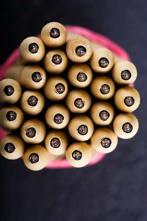 many beige pen on the dark background close up top view mock upの写真素材