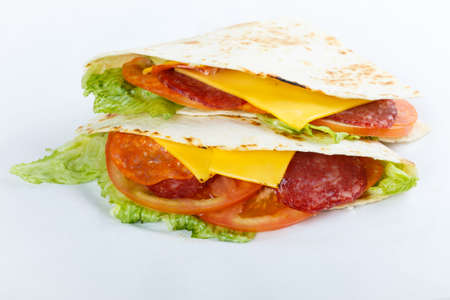 Burrito with grilled chicken and vegetables (fajitas, pita bread, shawarma)の写真素材