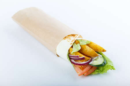 Burrito with grilled chicken and vegetables (fajitas, pita bread, shawarma)の写真素材