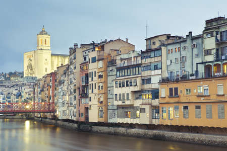 Great view of Girona and its Gothic Cathedral. We can see also the Eiffel Bridge in left hand and the typical river houses.の写真素材