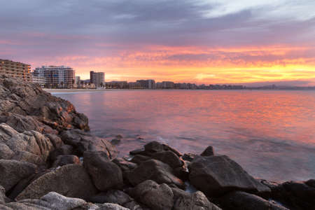Great sunset in Costa Brava, in a small beach called Torrevalentina.の写真素材