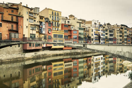 View of "Pont de la princesa" that means Princess Bridge in Girona, one of the four bridges of the city in a cloudy day.の写真素材