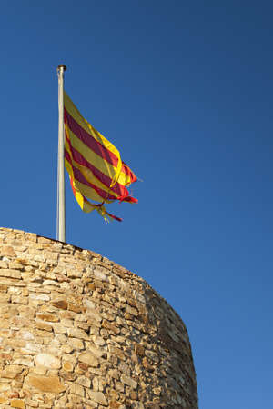 Detail of St. John Castle Tower with the catalonian flag at the top, in Blanes. Costa Brava.のeditorial素材