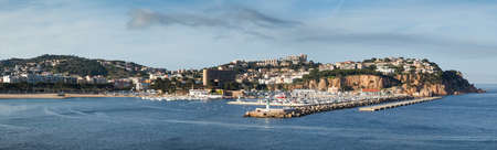 View of Sant Feliu de Guixols coast with its breakwater in afternoon. Costa Brava, Girona.の写真素材