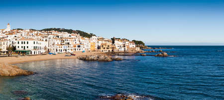 Calella de Palafrugell panorama, typical fishers village of Costa Brava with white houses at beach.の写真素材
