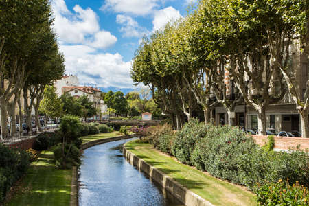 Picturesque view of Perpignan and its river in a sunny day. France.の写真素材