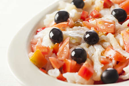 Catalonian codfish salad as known as "esqueixada", with cod, tomato and pepper.の写真素材