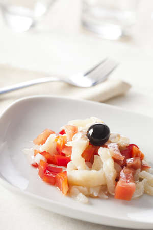 Catalonian codfish salad as known as "esqueixada", with cod, tomato and pepper.の写真素材