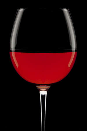 Rose wine glass on a black background.の写真素材
