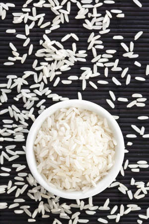 Top down view of a rice bowl on a black background with space for designers.の写真素材