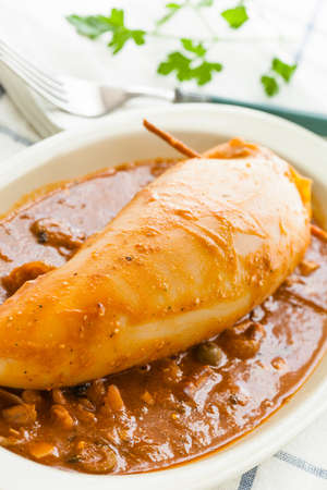 Delicious homemade stuffed squid with prawns, eggs, olives etc.の写真素材